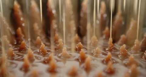 Dripping caramel flowing down sweet sauce. Trickle stream brown orange syrup Stock Footage 224522738