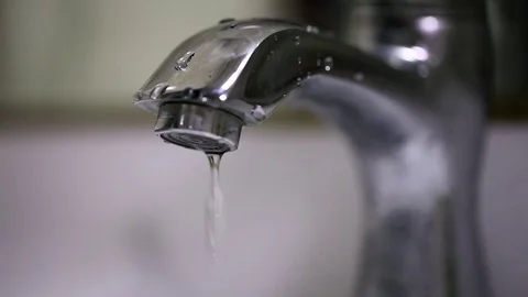 Dripping chrome water tap slow motion shot Stock Footage 74758993