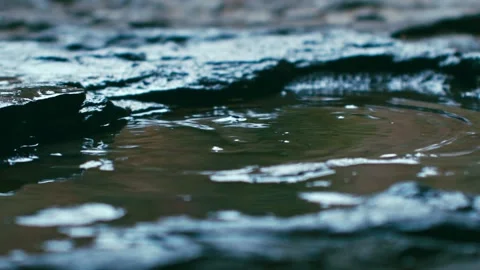 Dripping - Close-up of water drops and stone splashes 動画素材 256907172