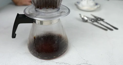 Dripping coffee from dripper into receiver : Making Hand Drip Coffee Stock Footage 116545083