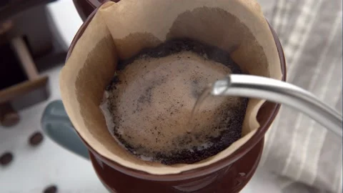 Dripping coffee image with mug , paper filter and kettle Stock Footage 143123883