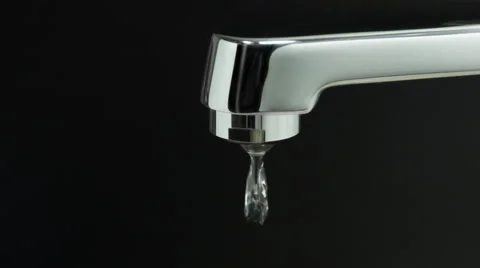 Dripping faucet on a black background Stock Footage 59850328