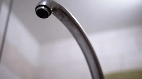 Dripping Faucet Close-up, Bottom view, Blurred background Stock Footage 312008269
