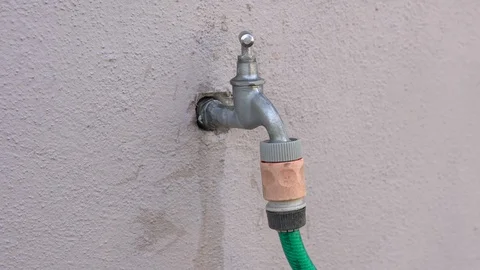 A dripping faucet in the garden Stock Footage 128041118