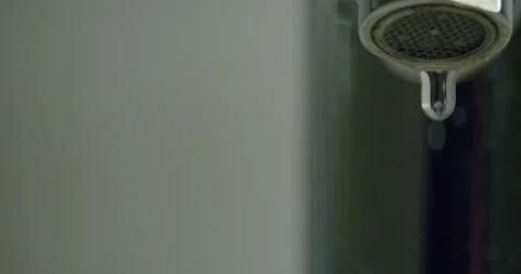 Dripping faucet / Right of frame / Slow motion Stock Footage 130985385