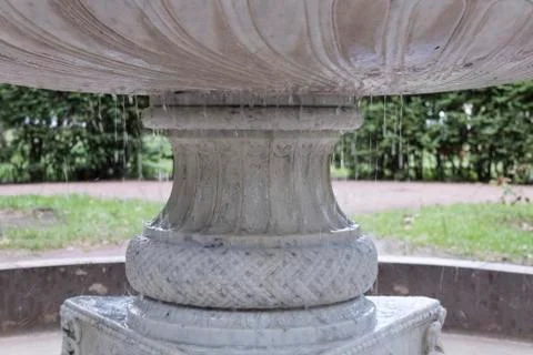 Dripping fountain in spring Stock Photos
