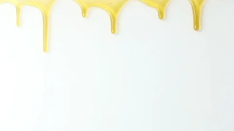Dripping honey seamlessly isolate on white background Stock Footage 104400250