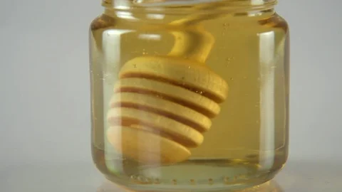 Dripping honey white backround Stock Footage 83039239