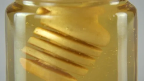 Dripping honey white backround Stock Footage 83039724