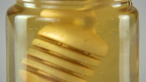Dripping honey white backround Stock Footage 83039888
