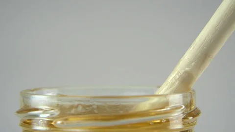 Dripping honey white backround Stock Footage 83040089
