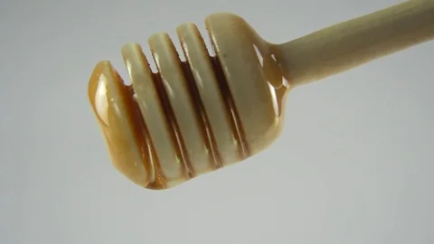 Dripping honey white backround Stock Footage 83041262