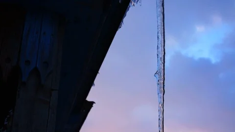 Dripping icicles, melting Icicles, Icicle hanging from roof, spring drops. Stock Footage 88731482