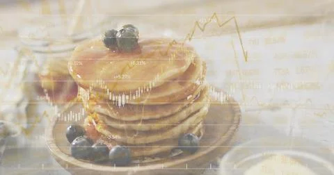 Dripping maple syrup over 5-6 pancake stack on kitchen table with blueberries, Stock Photos