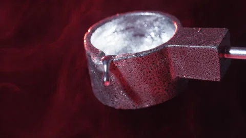 Dripping molten silver from ladle Stock Footage 147355115