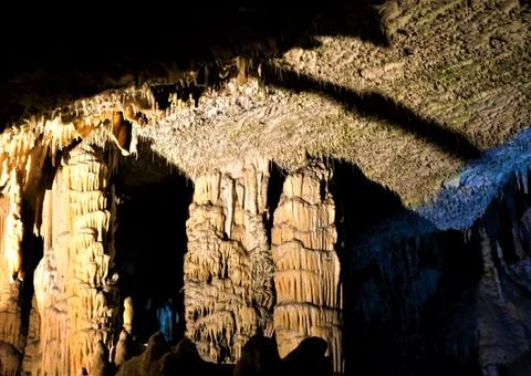 Dripstone columns in the spaghetti room of the Postojna caves Stock Photos