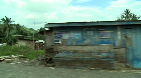 DRIVE-BY AFRICAN HUTS SHACKS AND LOW BUILDINGS Stock Footage 57981832