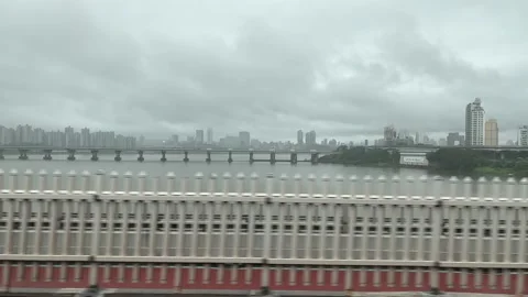 Drive along the Han river bridge in South Korea - overcast day Stock Footage 254697975