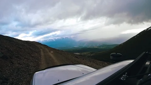 Drive a car uphill on a cloudy day. Auto travel: POV - Point of view SUV rides a Vídeos de archivo 110329006
