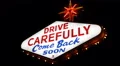 Drive Carefully Come Back Soon Icon Las Vegas Neon Sign Illuminated Night Lights HD Footage