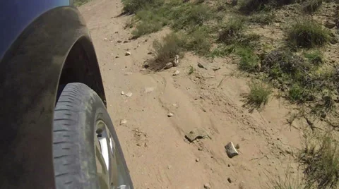 Drive desert road wheel turning POV fast motion HD 0065 Stock Footage 30351653