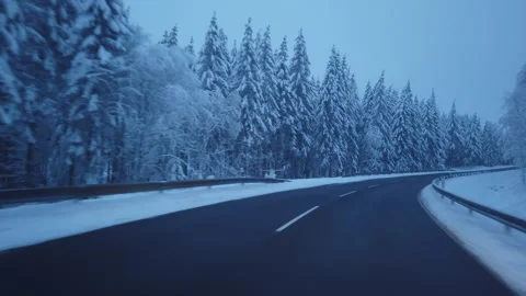 Drive from a driver's perspective along a winding country road through a sn.. Stock-Footage 273240533