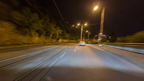 Drive at fast speed at the night streets timelapse hyperlapse drivelapse. Stock Photos