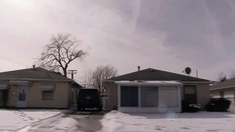 Drive by midwest homes in working class neighborhood, winter Stock Footage 89944647