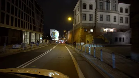 Drive by motion shot of driving down Tamka Street in inner city Warsaw at Stock Footage 104414751