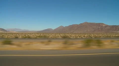 Drive plate, in the desert with no traffic, side view left,  Stock Footage