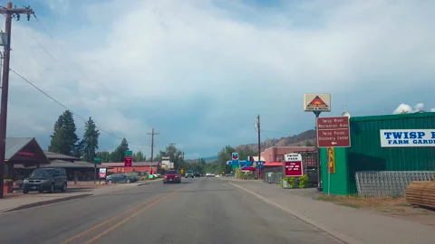 Drive Plate-Forward-Driving into mountain town of Twisp, Washington Stock Footage 239215367