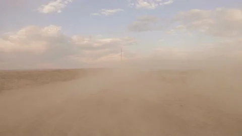Drive plate fpv of pulling out into a dust storm Stock Footage 152984817