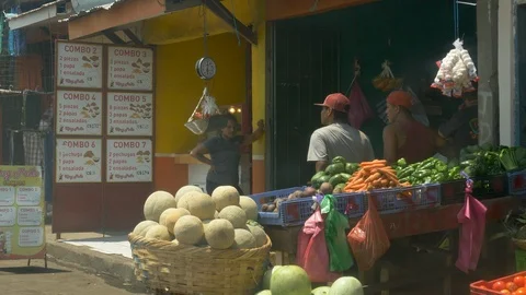 Drive Plate-passing roadside open air vendors in Rivas Nicaragua-POV Video stock 107700959