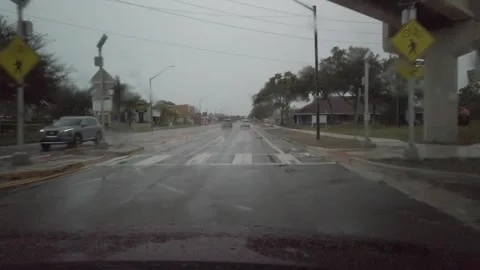 Drive Plate POV front going west on Central Avenue  in St Petersburg, FL. Rainy  Stock Footage 258962109