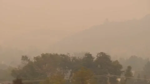 Drive Plate-POV-Interstate 5 in Oregon hills barely visible in thick smoke Stock Footage 140701401