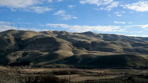 Drive Plate-POV-Side view I84 southeast Oregon shadow hills wind turbines Stock Footage 88416614