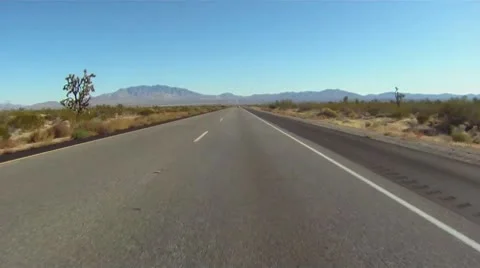 Drive plate, POV through the desert in morning Stock Footage