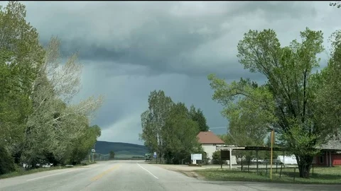 Drive Plate-POV-View forward leaving Hayden Colorado cloudy day Stock Footage 76546760