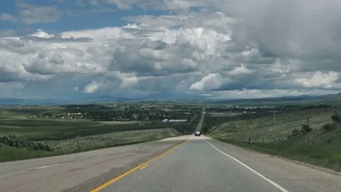Drive Plate-POV-View forward downhill approaching Craig Colorado Stock Footage 76580554