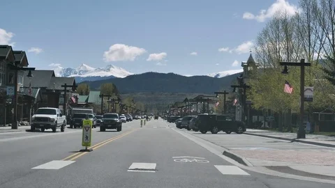 Drive Plate-POV-View forward-Historic Frisco Colorado Memorial Day Flags Stock Footage 76627916