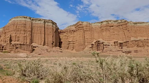 Drive Plate-Side-Passing massive cliffs of layered sandstone formation Stock Footage 243839839