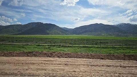 Drive Plate-Side-Road construction, Green fields Distant Mountains Stock Footage 243057503