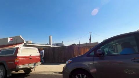 Drive Plate-Sideview-Driving through the small rural town of Richland, Oregon Stock Footage 215311105