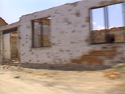 Drive plate, through totally destroyed town Croatia, war zone Stock Footage