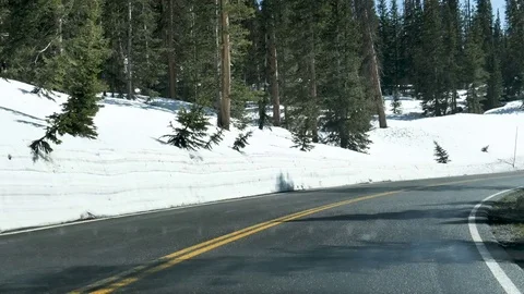 Drive Plate-Time Lapse-Driving Mountain Road Rocky Mountain National Stock Footage 77082733