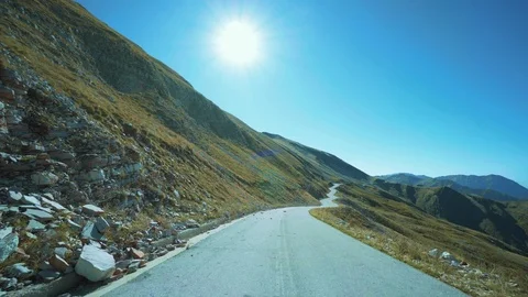Drive pov high mountain road national park Stock Footage 89970922