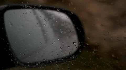 Drive in the rain View from inside the car, see the car's mirror Stock Footage 86199827