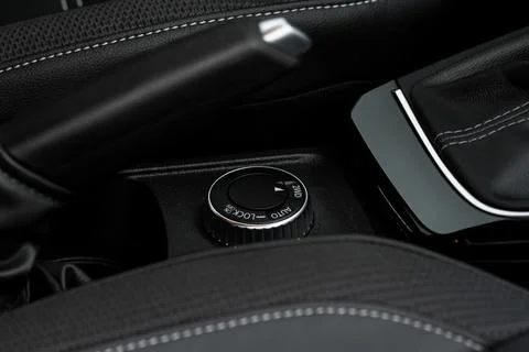 Drive selector button. Car interior, offroad drive controller closeup view. W Foto stock