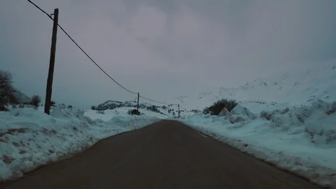 Drive on snow covered mountain forest landscape at dusk or dawn Stock Footage 101820030
