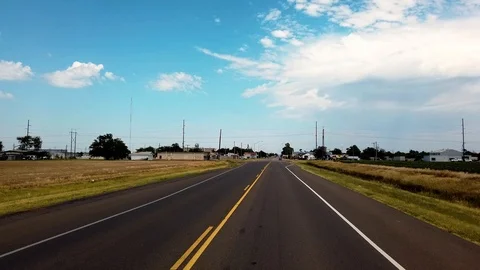Drive straight ahead coming up to small town Stock Footage 114990941
